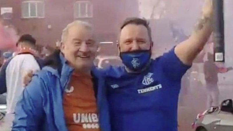 Loyalist Gary Lenaghan was pictured hugging east Belfast community worker Jim Wilson during the celebrations. Picture from social media 