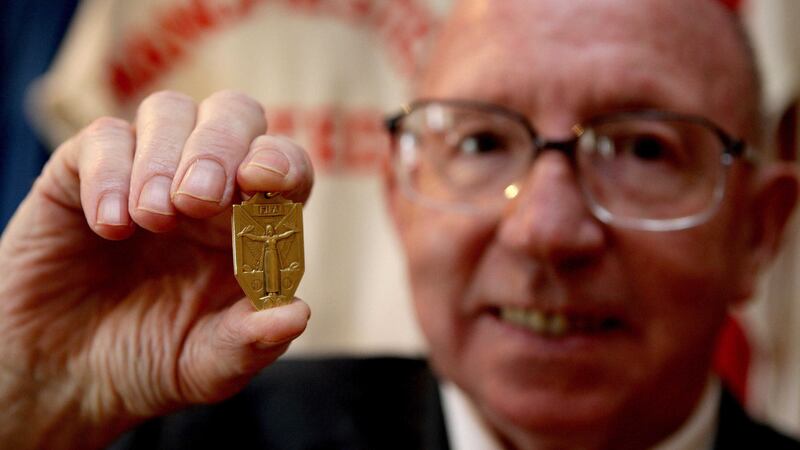 England World Cup winner Nobby Stiles holding his 1966 World Cup winners medal