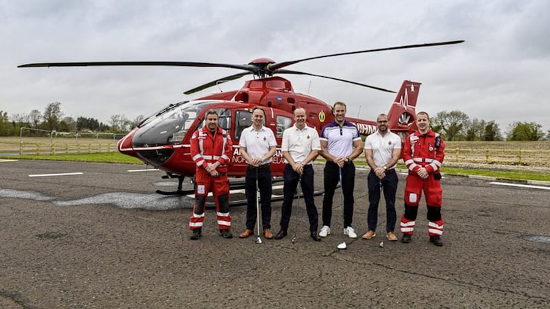 Former rugby internationals, Stephen Ferris and Andrew park are to take part in a 225-mile golfing challenge in aid of the Air Ambulance Northern Ireland (AANI) and Children in Crossfire. Pictured are Dr Darren Monaghan, Clinical Lead, AANI, Ashely Moore, Gary Irwin, Stephen Ferris, Andrew Park and David McCartney, HEMS Paramedic 