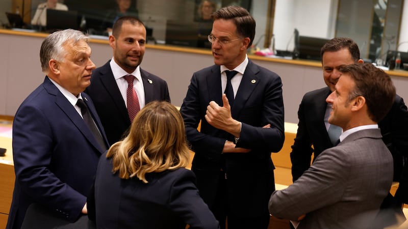 Hungary’s Prime Minister Viktor Orban, Malta’s Prime Minister Robert Abela, Netherland’s Prime Minister Mark Rutte, Portugal’s Prime Minister Luis Montenegro, French President Emmanuel Macron and Italy’s Prime Minister Giorgia Meloni speak during a round table meeting at an EU summit in Brussels (Omar Havana/AP)