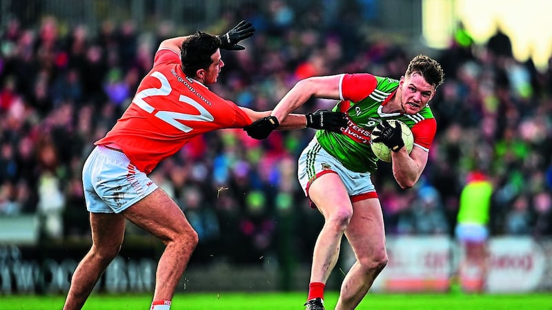 Mayo's Matthew Ruane is tackled by Stefan Campbell during the Allianz Football League Division One match at Dr Hyde Park in Roscommon<br />Picture: Sportsfile&nbsp;