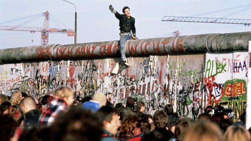 Political change can come swiftly, like the end of apartheid in South Africa or the fall of the Berlin Wall in 1989 (pictured). 