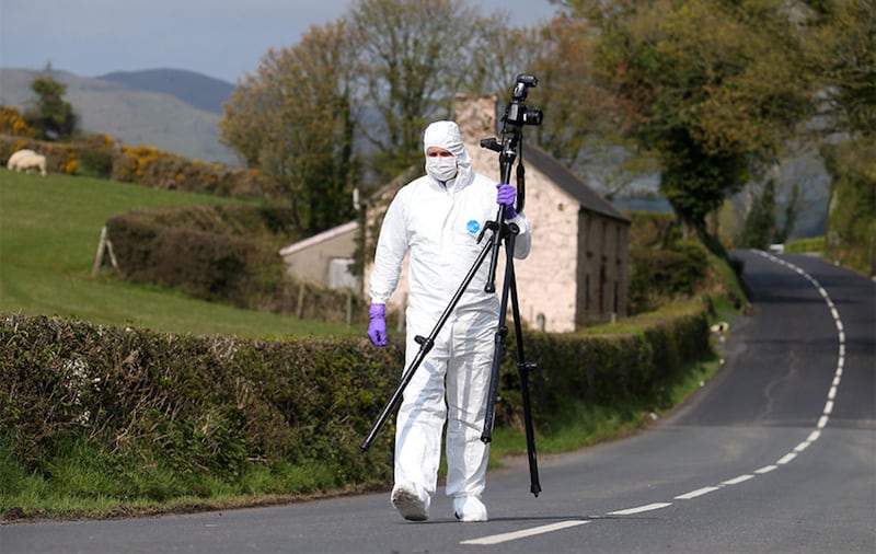 A forensic officer outside Castlewellan, Co Down, where a mortar bomb launching tube was found. Picture by Mal McCann