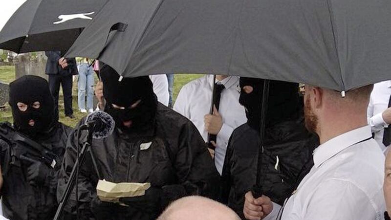 Suspected armed and masked men deliver threat during oration at a republican commemoration in Belfast  
