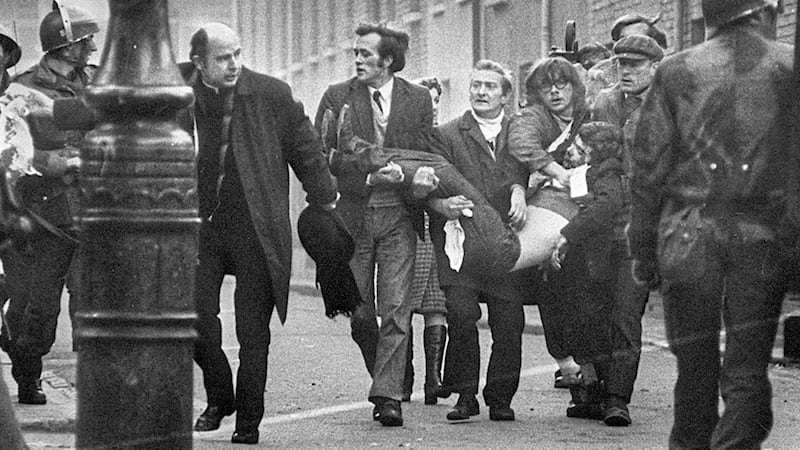 Hugh McMonagle, directly to Bishop Edward Daly&#39;s left, helped carry the body of Jackie Duddy from Derry&#39;s Bogside on Bloody Sunday. 