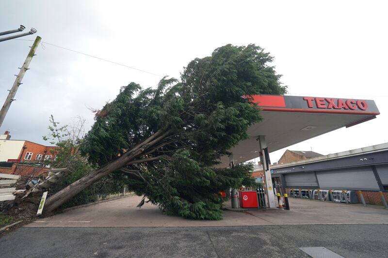A tree fallen onto the roof of a Texaco petrol station in Derby
