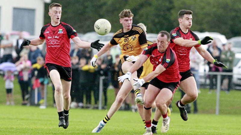 A shot by Portglenone&#39;s Aidan McAleese is blocked by Bernard Graham as James Magee and Eoin Graham watch on. Picture by Philip Walsh 