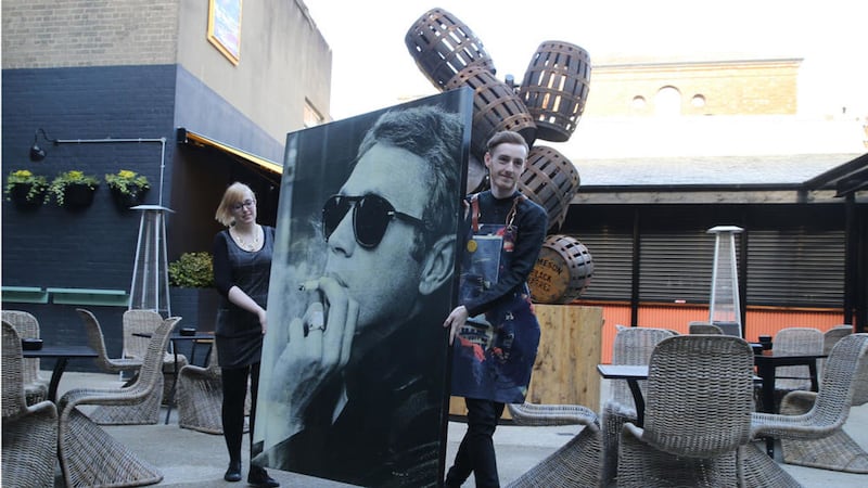 The portrait of Steve McQueen on its way back into the Bullitt Hotel on Ann Street in Belfast. Picture by Hugh Russell