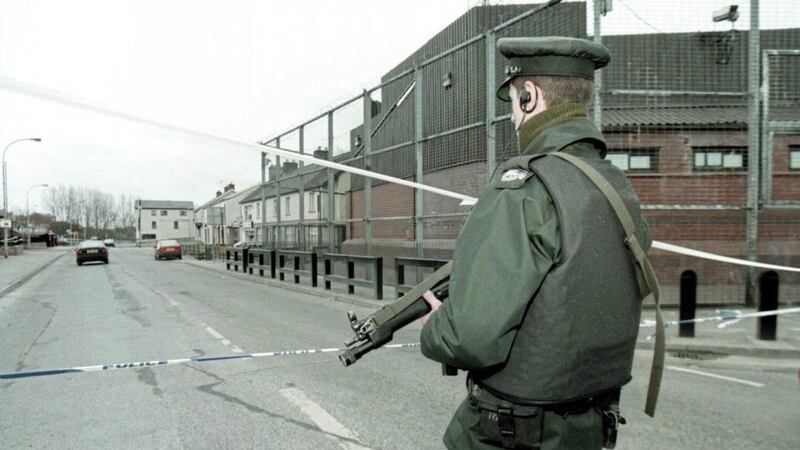 An RUC officer at a cordon around Coalisland police station in 1997, following an IRA bomb attack. 
