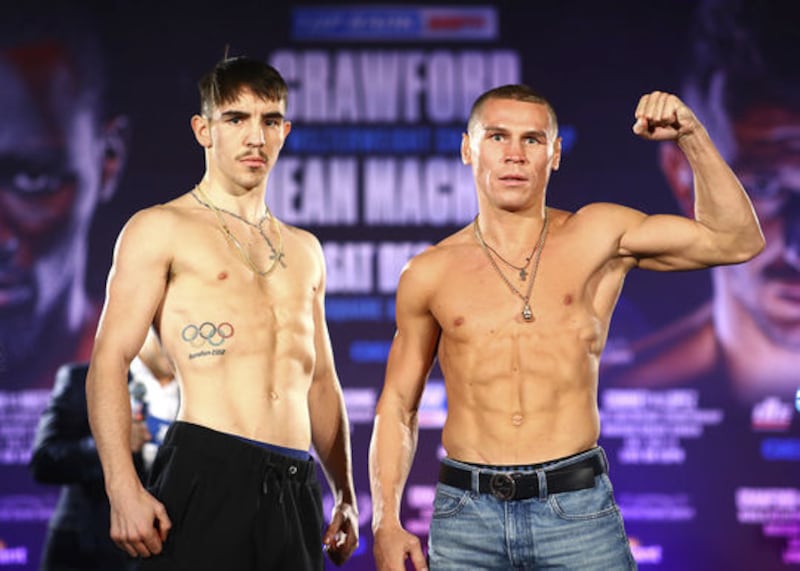 &nbsp;Michael Conlan (left) and Russia&rsquo;s Vladimir Nikitin at the weigh-ins in New York yesterday. Picture by Mikey Williams / Top Rank