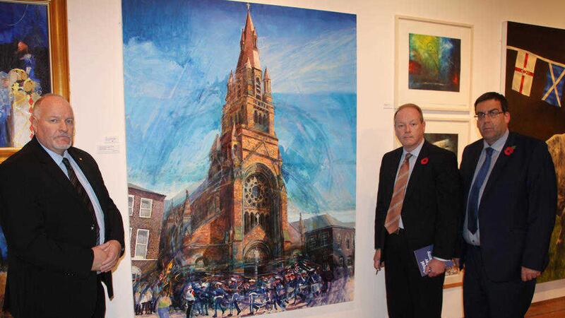DUP MLAs David Hilditch, William Humphrey and Stephen Moutray beside the painting on display at the Ulster Museum   