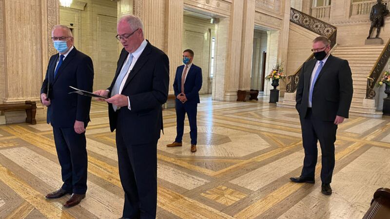Outgoing UUP leader Steve Aiken speaks to the media at Stormont this morning as MLAs Robbie Butler and Doug Beattie look on. Picture by Mal McCann&nbsp;