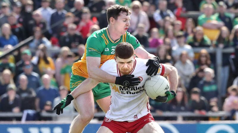 Cathal McShane holds possession under pressure from Jamie Brennan. Picture: Margaret McLaughlin