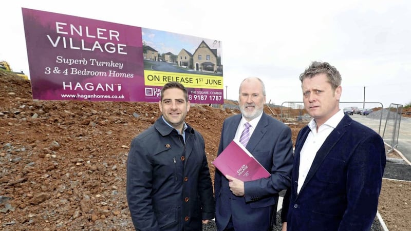 Pictured at the 112 acre &lsquo;Enler Village&rsquo; site are: Jamesy Hagan, managing director, Hagan Homes; Lindsay Fyfe, estate agent and Jim Campbell, managing director, Rowallane Construction Ltd. 