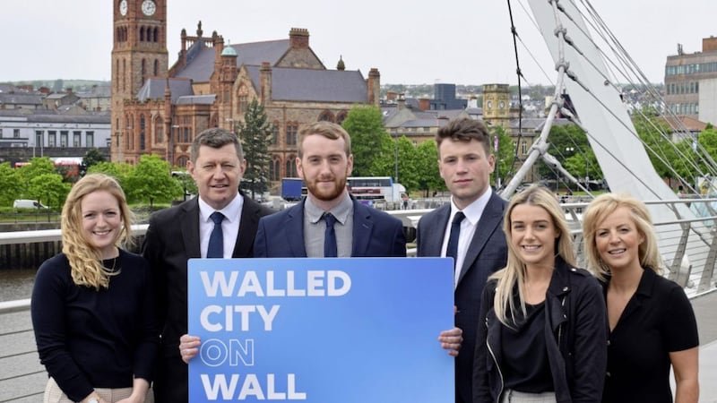 Pictured at the Peace Bridge in Derry are: Greg McCann, FinTrU executive director (second left); Nicola Curry, business development manager at North West Regional College (far right) and FinTru Academy graduates and now analysts; Jenny Thompson, Damian Faulkner, CJ Martin and Megan Quigley. 
