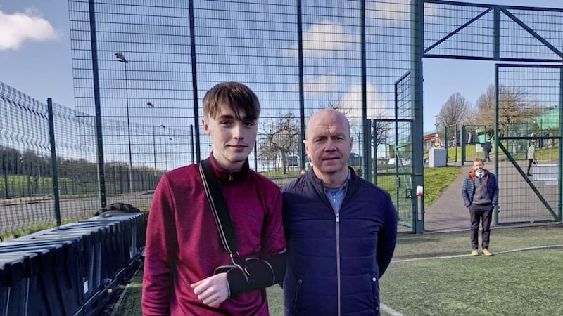 Col&aacute;iste na Carraige player Ryan Jones, who was injured in a schools&#39; game, pictured with Tyrone All-Star Peter Canavan, who made a presentation to Jones on behalf of Ulster Schools&#39; GAA. 