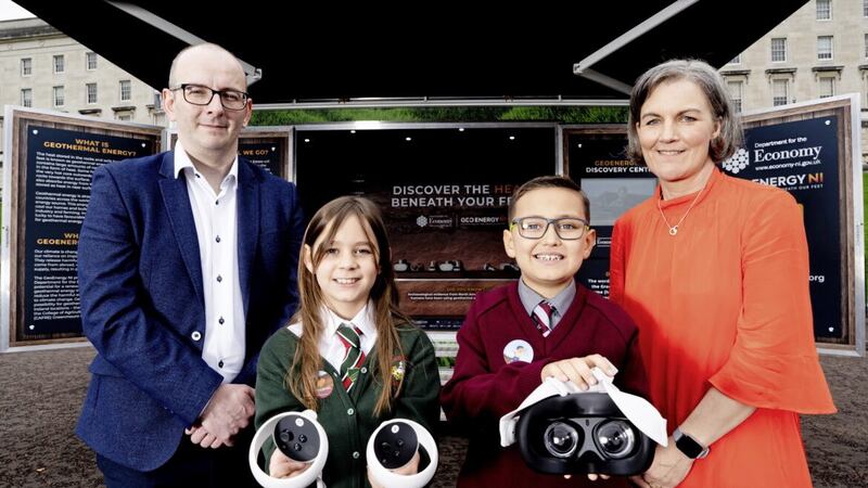 Millie from Dundonald Primary School and Jayden from Holy Trinity Primary School in Belfast, pictured with Ryan White from DfE and GSNI&#39;s Marie Cowan. 
