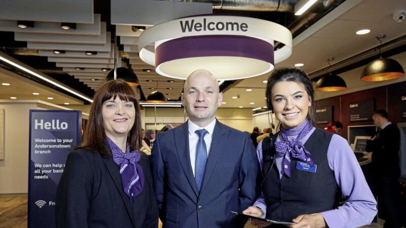 Sean Murphy, managing director of personal banking, Ulster Bank, officially opens the bank&rsquo;s new branch at the Westwood Centre in west Belfast with branch manager, Colette O&rsquo;Hare, left, and personal banker Hannah Clarke, right. 
