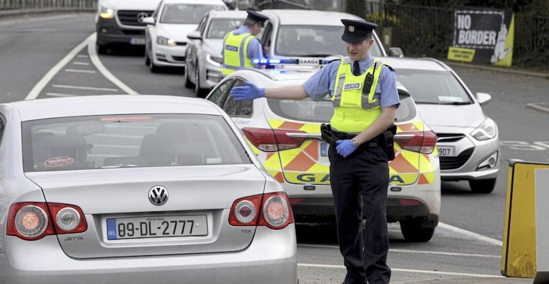 Garda officers stopping motorists on the border between Lifford and Strabane yesterday. 