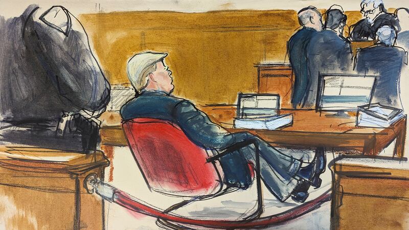 Donald Trump leans back in his chair at the defence table during the first week of his trial (Elizabeth Williams via AP)