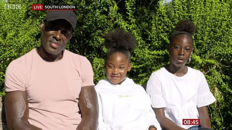 Patrick Huthcinson and his daughters Sidena and Kendal appearing on BBC Breakfast earlier this week after Mr Hutchinson made global headlines after saving a man, later identified as a retired detective, from harm during violent protests in central London last weekend. Picture by BBC Breakfast/PA
