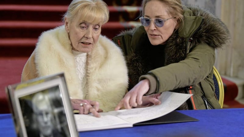 Sharon Stone with Betty Williams at Belfast City Hall in January 2020 signing a book of condolence in memory of Seamus Mallon. Picture by Alan Lewis. 