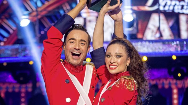 Katya Jones and Joe McFadden with the Strictly Come Dancing glitterball trophy PICTURE: Guy Levy/BBC/PA 
