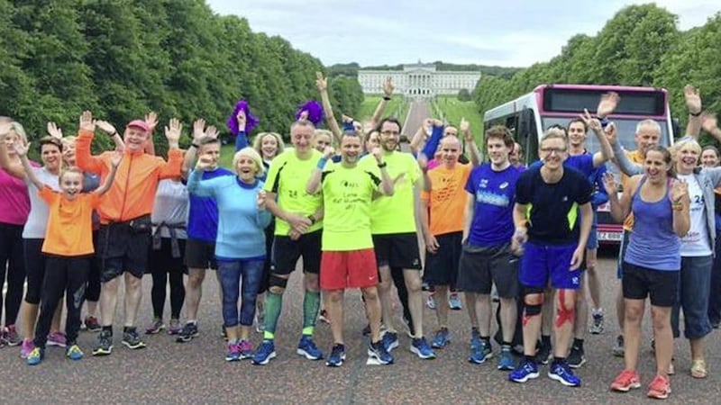 The 24in24 team and their supporters after finishing the Stormont park run 