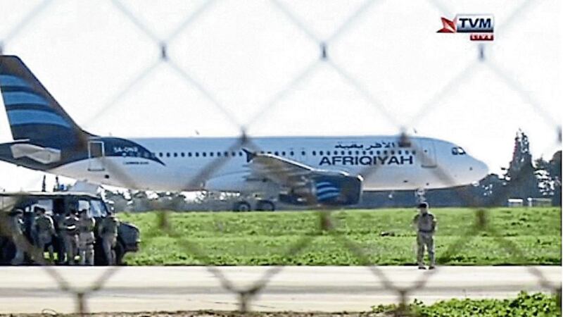 DIVERTED: A hijacked Afriqiyah Airways A320 sits on the tarmac at Malta International airport       Picture: TVM via AP 