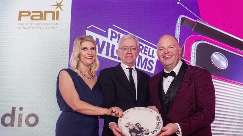 Q Radio&#39;s Orla Ross (agency sales director) and Robert Walshe (managing director) receive the Gold Award in the Media Owner Initiative Category from PANI Council member and past chairman Tony Axon (centre) 