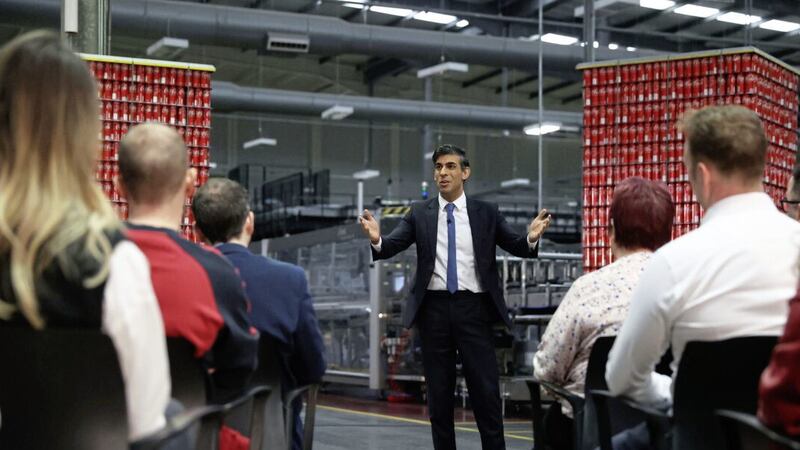 British Prime Minister Rishi Sunak speaking with business leaders during a visit to Coca-Cola factory in Lisburn on Tuesday. Picture by Liam McBurney/PA Wire. 