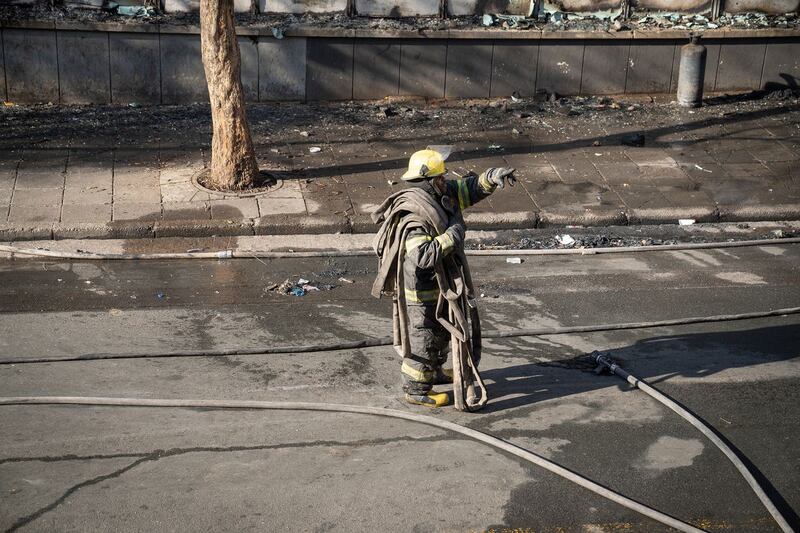 A fireman works at the scene of a deadly blaze in Johannesburg