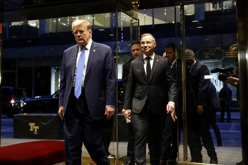 Republican presidential candidate former President Donald Trump walks with Poland’s President Andrzej Duda at Trump Tower in New York (Stefan Jeremiah/AP)