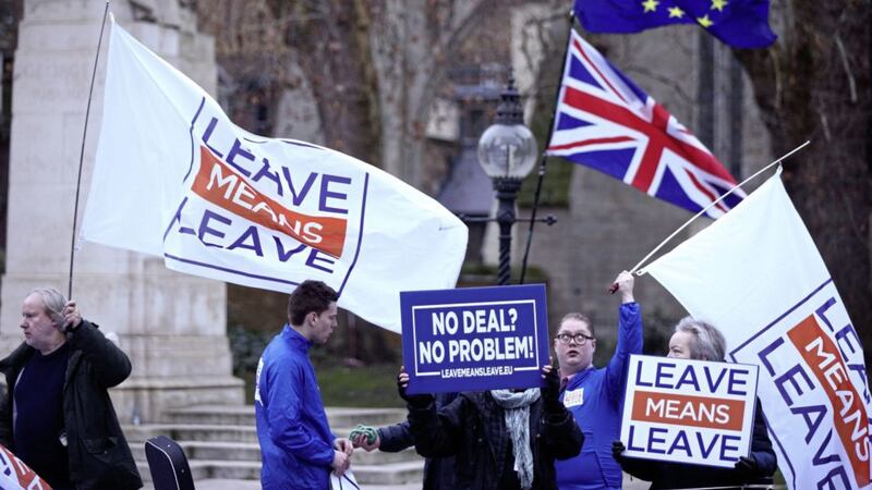 Anti-Brexit demonstrators outside Parliament in Westminster, London. Theresa May will intensify efforts to win over her Brexit critics and seek fresh guarantees from Brussels ahead of next week&#39;s crunch vote on her deal Picture by Yui Mok/PA 
