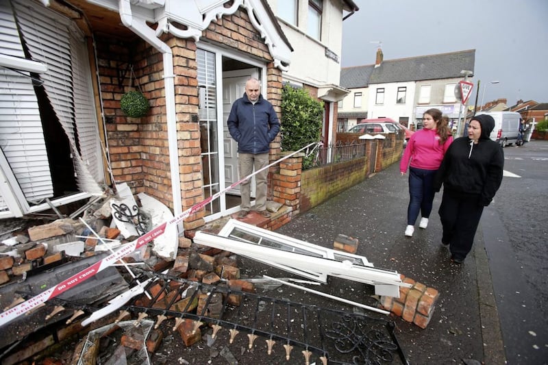 Sean Murray surveys the damage caused to his daughters home in Cavendish Street after a stolen Landrover Discovery was crash in it Picture Mal McCann. 