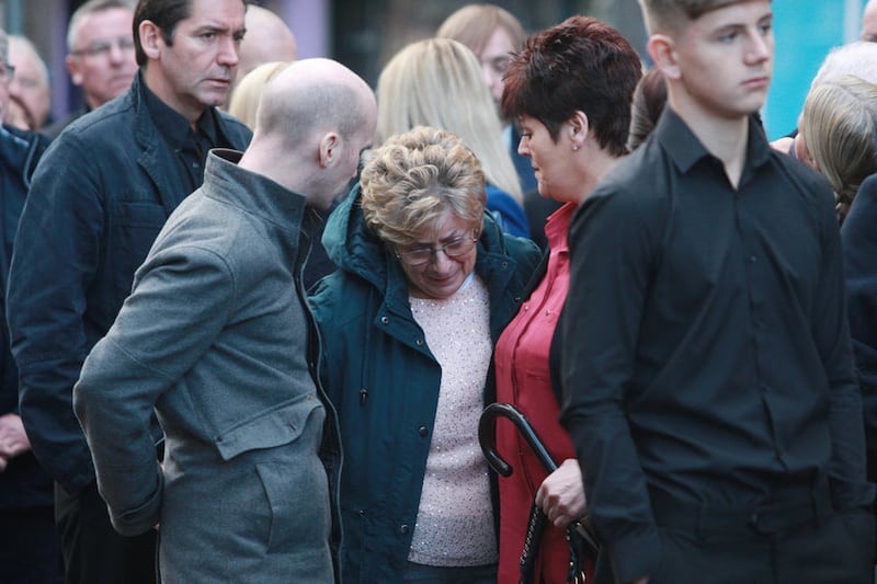 Bap Kennedy&#39;s mother Lily is overcome with grief as mourners gather at O&#39;Kanes in Donegall Street ahead of his funeral. Picture by Bill Smyth 