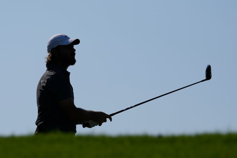 Tommy Fleetwood follows his ball on the 11th hole during the first round of the Dubai Invitational (Kamran Jebreili/AP)