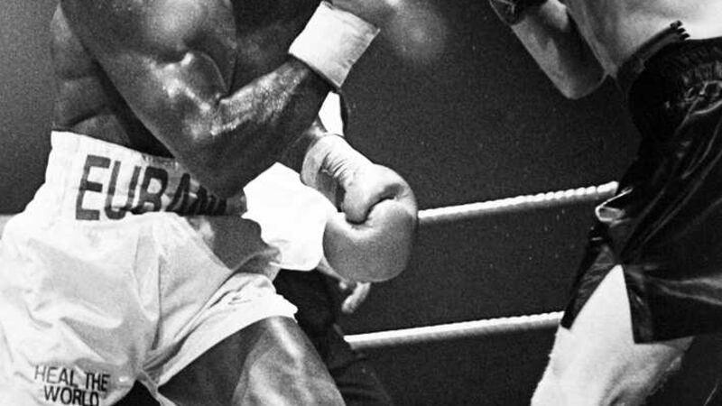 Belfast's Ray Close takes the fight to Chris Eubank in the King's Hall Belfast in 1994. Picture by Ann McManus&nbsp;