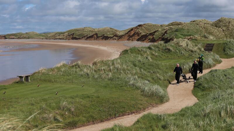 Golfers walking along the coastal path on the Doonbeg Golf Links course and hotel in Co Clare in 2014. Picture by Niall Carson, Press Association &nbsp;
