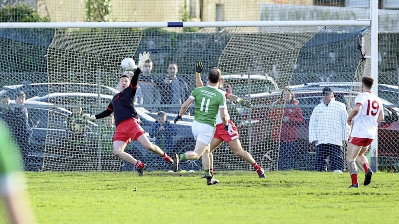 Cargin&#39;s Michael McCann rattles home the only goal of the game after 48 minutes of yesterday&#39;s Antrim SFC final, which ended in a draw. Picture by Cliff Donaldson 
