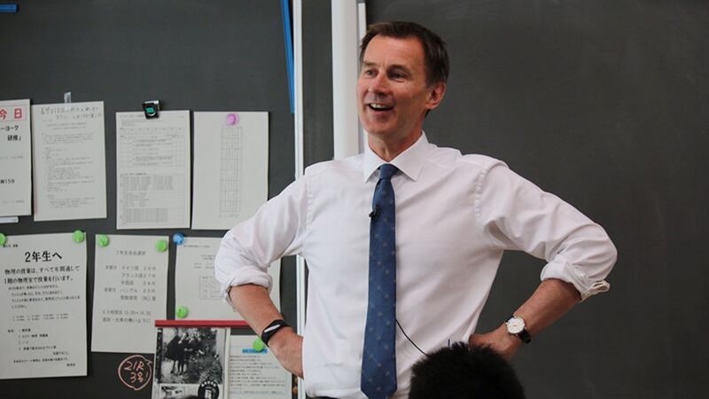 Britain's foreign secretary Jeremy Hunt teaches an English lesson during a visit to Tokyo Metropolitan Hibiya High School&nbsp;