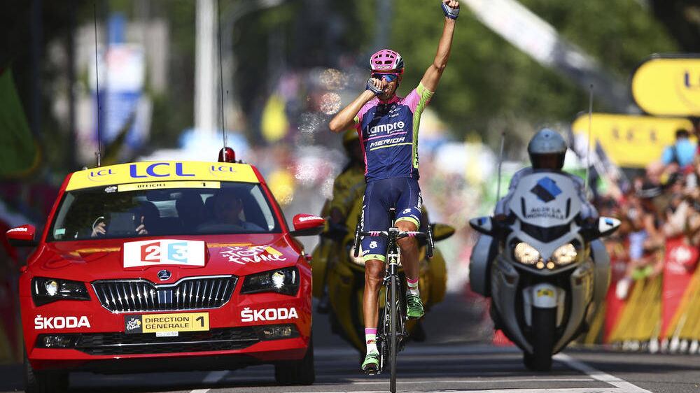 Spain&#39;s Ruben Plaza Molina celebrates as he crosses the finish line to win the sixteenth stage of the Tour de France 