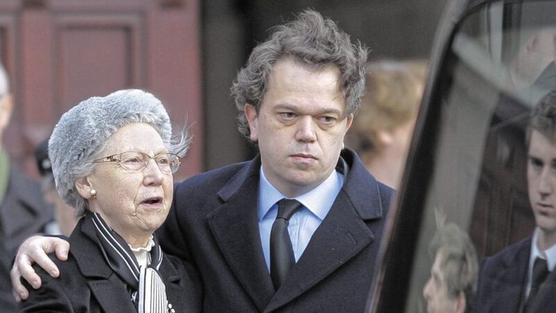 Joan Travers, who passed away on Friday, pictured with son Hugh at the funeral of husband Tom in 2009. Her 22-year-old daughter Mary was murdered by the IRA in 1984. Picture by Cliff Donaldson 