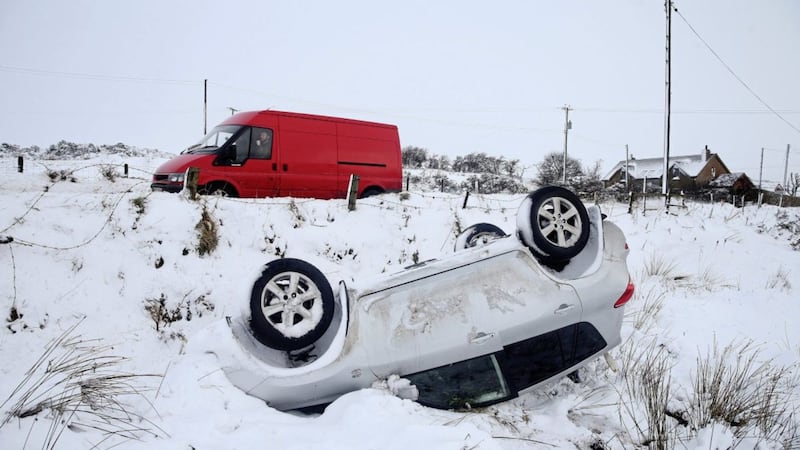 A car overturned in a ditch outside Ligoniel, north Belfast. Picture by Mal McCann 