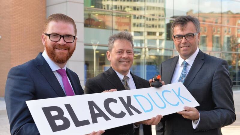 Economy Minister Simon Hamilton MLA along with Lou Shipley Black Duck Software and Alastair Hamilton Invest NI 