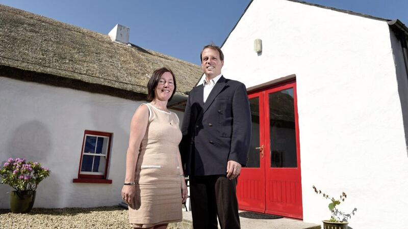 Iain Greenway DFC Director of Historic Environment Division is pictured with Elizabeth McCardle who is a previously received a grant from the fund to restore her thatched home in Lisburn. Picture by Michael Cooper 