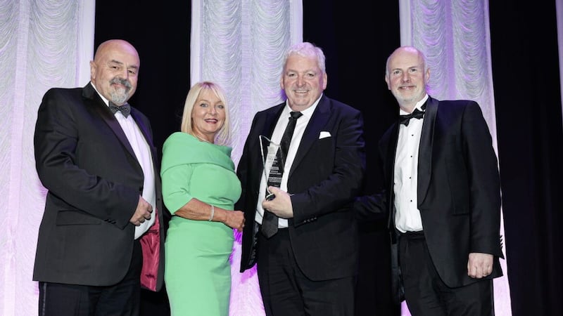 Feargal McCormack receives the lifetime achievement award at AIB Business Eye Awards from Richard and Brenda Buckley from Business Eye magazine, and Brian Gillan, head of retail &amp; NI at AIB. Picture: Kelvin Boyes/PressEye 