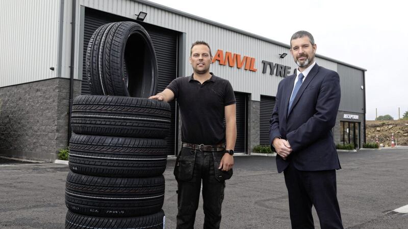 Ulster Bank business development manager Philip McNeill with Anvil Tyre Centre&rsquo;s Daniel Wethers 