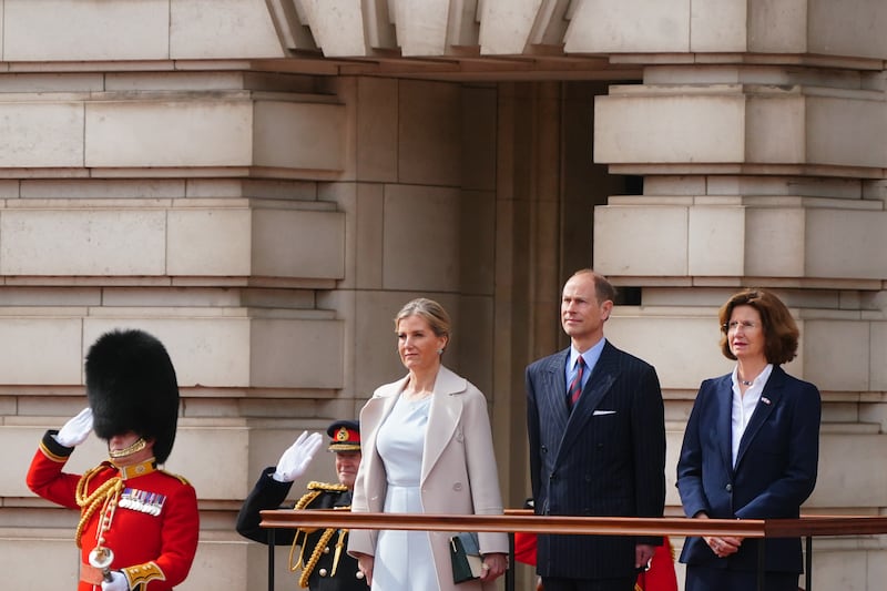 The Duke and Duchess of Edinburgh, on behalf of the King, watch the ceremony with French ambassador to the UK, Helene Duchene