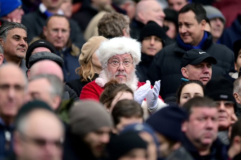 A Chelsea fan dressed as Santa